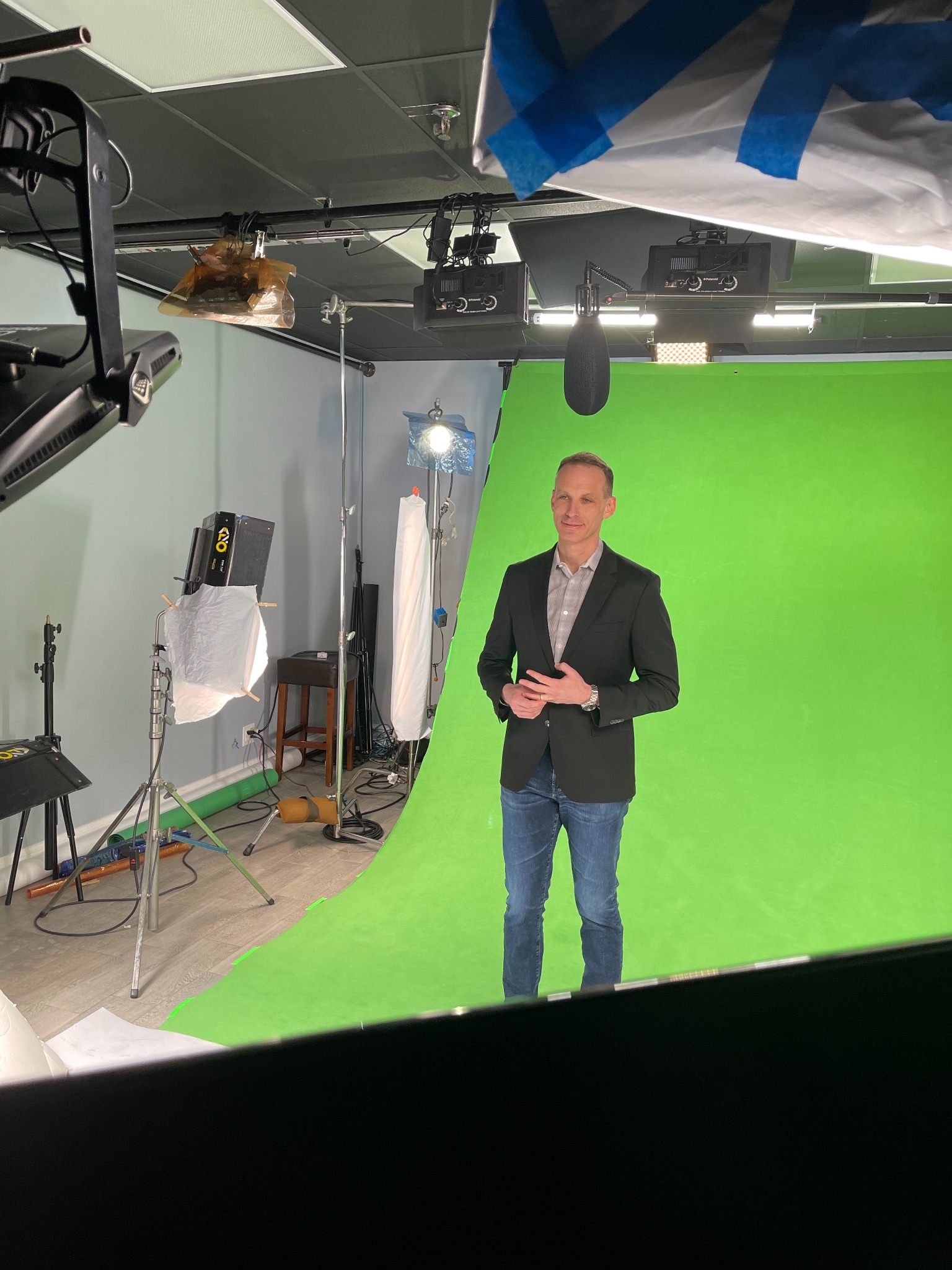 Talent on set in Magdalin studio during a green screen shoot